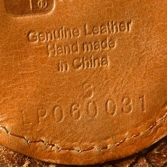 Linea Pelle tan Woven Wide Belt with two enormous D rings as the centerpiece.